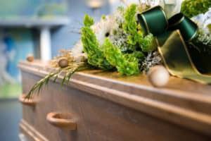 9132924 - a coffin with a flower arrangement at a mortuary